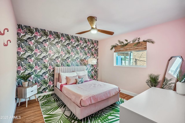 bedroom featuring hardwood / wood-style flooring and ceiling fan