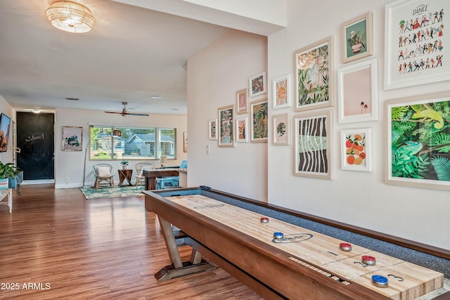 recreation room featuring hardwood / wood-style flooring and ceiling fan