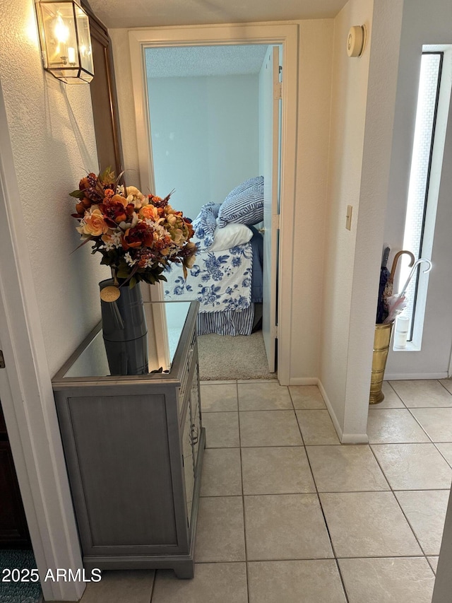 hallway with light tile patterned flooring