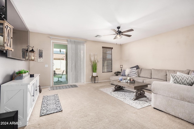 carpeted living room featuring ceiling fan