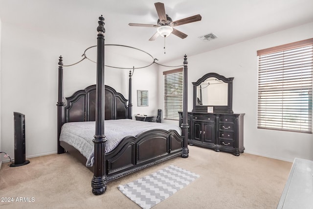 bedroom featuring ceiling fan and light colored carpet