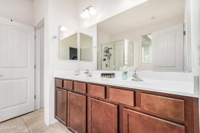 bathroom with vanity, tile patterned floors, and walk in shower