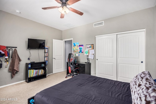 bedroom with carpet flooring, ceiling fan, and a closet