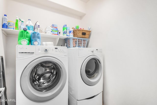 washroom with washer and clothes dryer