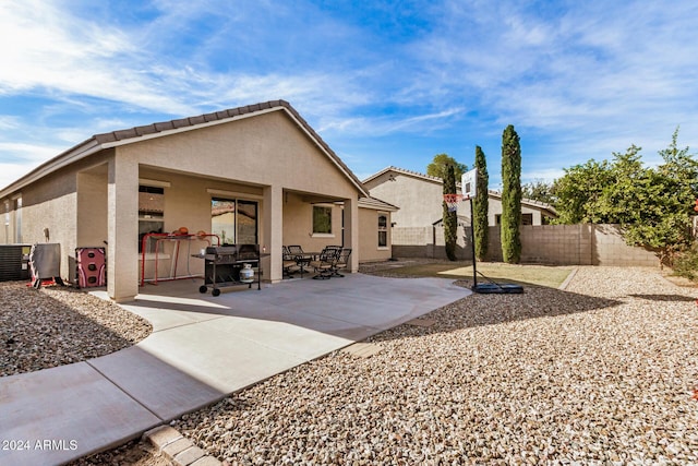 back of property featuring a patio