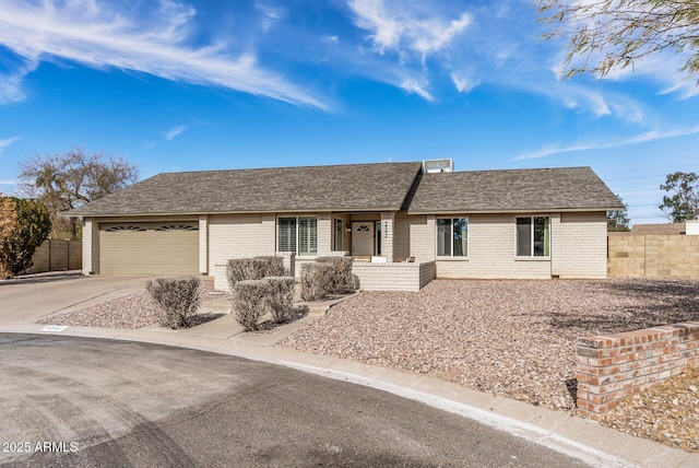 single story home with a garage