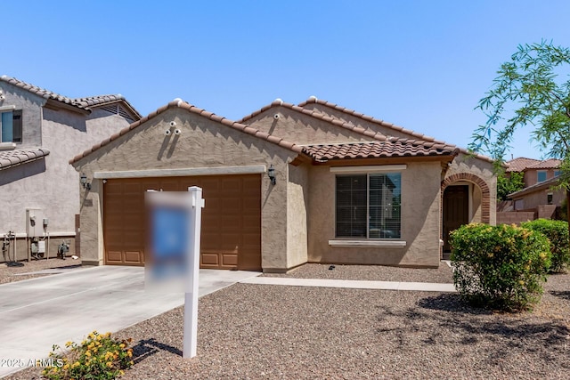 7086 W Spur Dr, Peoria, AZ 85383 - mediterranean / spanish home with a garage, driveway, stucco siding, and a tile roof
