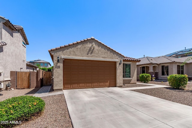 7086 W Spur Dr, Peoria, AZ 85383 - mediterranean / spanish house featuring stucco siding, driveway, a garage, and a tiled roof