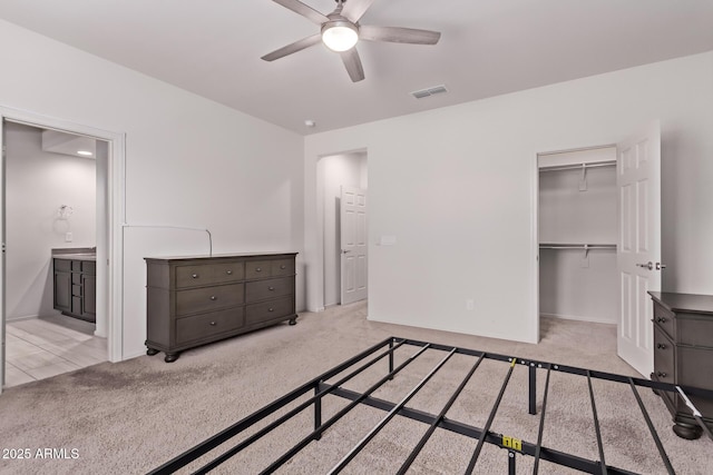 7086 W Spur Dr, Peoria, AZ 85383 - unfurnished bedroom with carpet floors, a closet, connected bathroom, a spacious closet, and ceiling fan