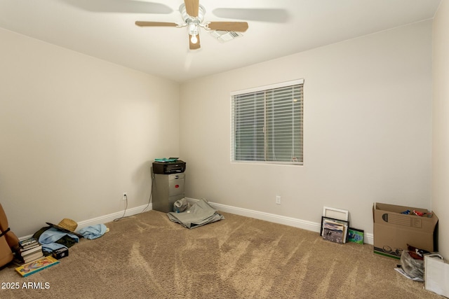 misc room with ceiling fan and carpet flooring