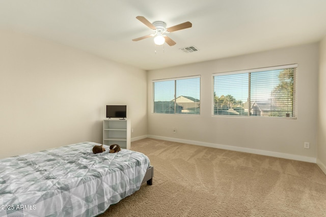 carpeted bedroom with ceiling fan