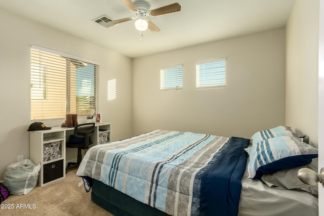 carpeted bedroom featuring ceiling fan