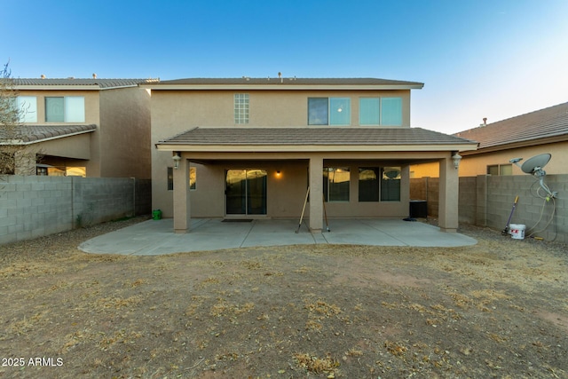 rear view of house featuring a patio