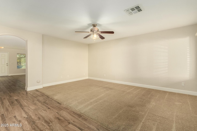 unfurnished room featuring ceiling fan and wood-type flooring