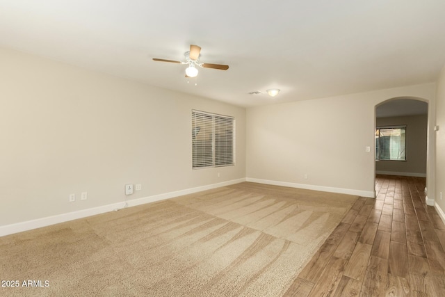 spare room featuring ceiling fan and hardwood / wood-style floors