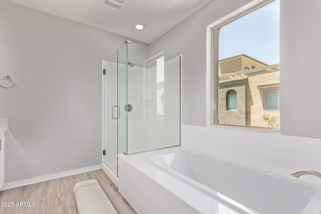 7492 E Via De Luna Dr, Scottsdale, AZ 85255 - bathroom with a shower stall, a garden tub, and wood finished floors