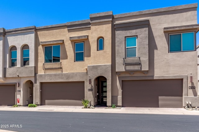 7492 E Via De Luna Dr, Scottsdale, AZ 85255 - multi unit property featuring an attached garage, stucco siding, and a balcony