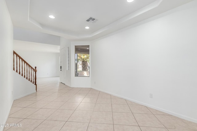 2302 S Canfield, Mesa, AZ 85209 - empty room with stairs, recessed lighting, a tray ceiling, light tile patterned floors, and baseboards