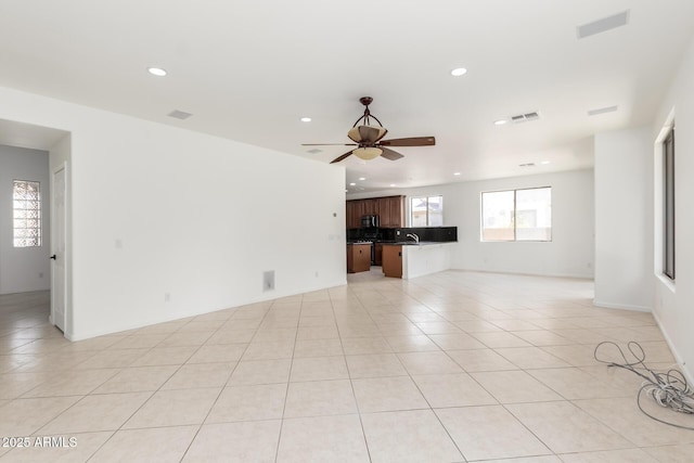 2302 S Canfield, Mesa, AZ 85209 - unfurnished living room with recessed lighting, ceiling fan, light tile patterned flooring, and a sink