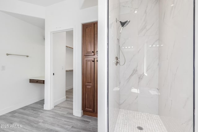 2302 S Canfield, Mesa, AZ 85209 - full bath with a marble finish shower, a walk in closet, wood finished floors, and baseboards