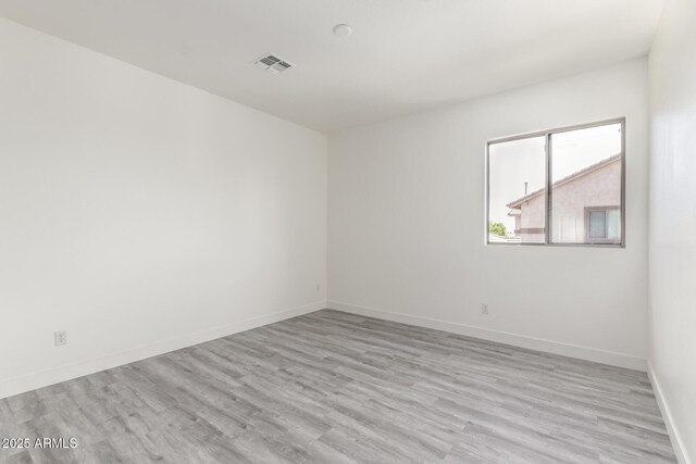 2302 S Canfield, Mesa, AZ 85209 - unfurnished room featuring light wood-type flooring and baseboards
