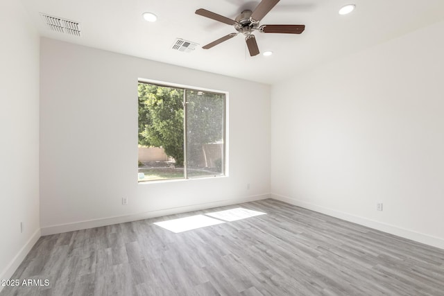 2302 S Canfield, Mesa, AZ 85209 - empty room featuring recessed lighting, wood finished floors, a ceiling fan, and baseboards