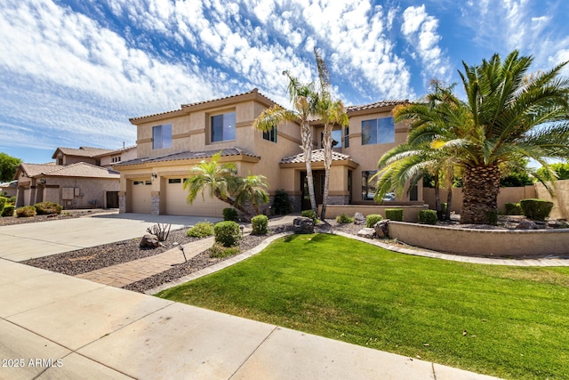 2302 S Canfield, Mesa, AZ 85209 - mediterranean / spanish home with stucco siding, an attached garage, concrete driveway, a tile roof, and a front lawn
