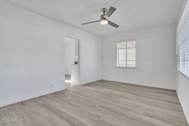 unfurnished room with light hardwood / wood-style flooring and ceiling fan