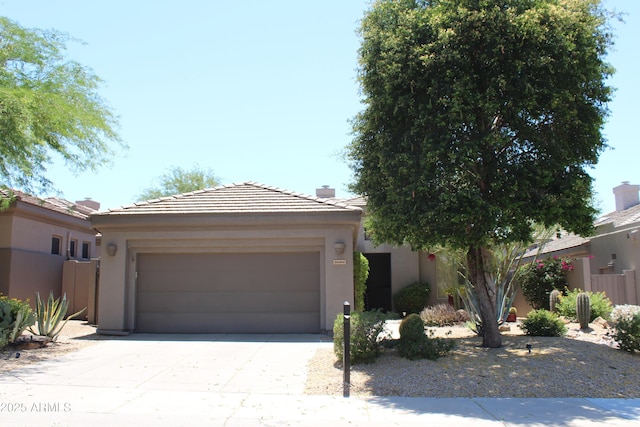 34464 N 68th Way, Scottsdale, AZ 85266 - view of front of home with driveway, an attached garage, stucco siding, a tiled roof, and a chimney