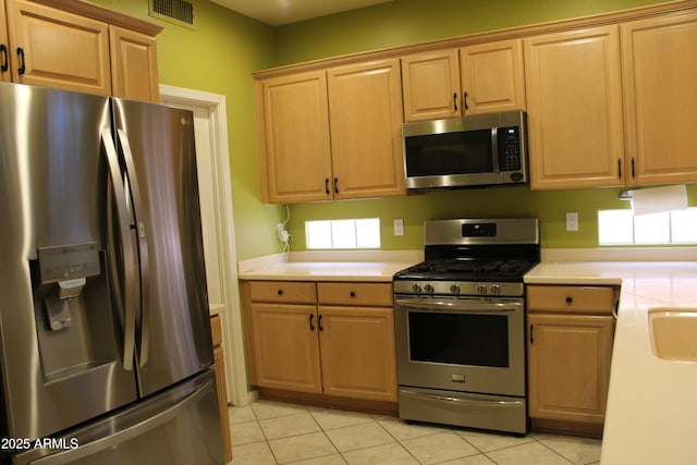 34464 N 68th Way, Scottsdale, AZ 85266 - kitchen featuring stainless steel appliances, light countertops, and light tile patterned floors