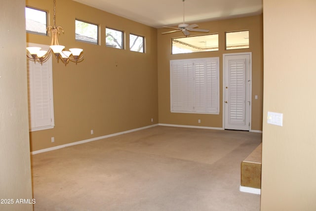34464 N 68th Way, Scottsdale, AZ 85266 - empty room featuring carpet flooring, a chandelier, and ceiling fan