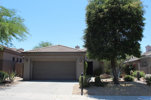 34464 N 68th Way, Scottsdale, AZ 85266 - view of front of property with a garage, driveway, stucco siding, and a chimney