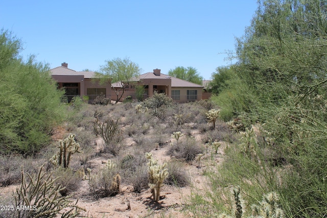 34464 N 68th Way, Scottsdale, AZ 85266 - rear view of property with a chimney and stucco siding