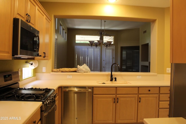 34464 N 68th Way, Scottsdale, AZ 85266 - kitchen featuring stainless steel dishwasher, gas stove, light countertops, and a chandelier
