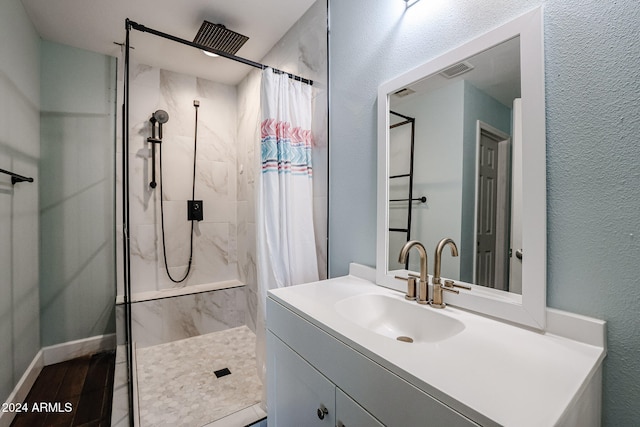 bathroom featuring a shower with curtain, vanity, and hardwood / wood-style flooring