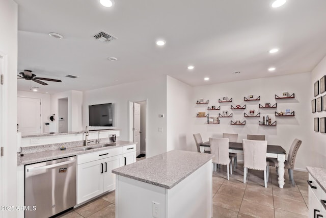 932 W Capulin Trl, San Tan Valley, AZ 85140 - kitchen featuring stainless steel dishwasher, a sink, light tile patterned flooring, white cabinetry, and recessed lighting
