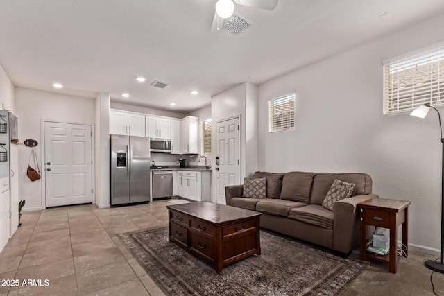 932 W Capulin Trl, San Tan Valley, AZ 85140 - living area featuring healthy amount of natural light, a ceiling fan, baseboards, recessed lighting, and light tile patterned floors