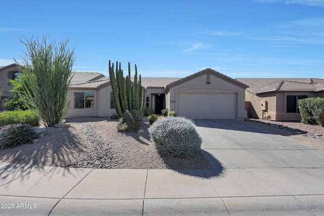 26647 N 43rd St N, Cave Creek, AZ 85331 - ranch-style house featuring a garage, a tile roof, driveway, and stucco siding
