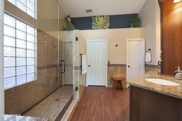 26647 N 43rd St N, Cave Creek, AZ 85331 - full bath with tile walls, a stall shower, vanity, and a wainscoted wall