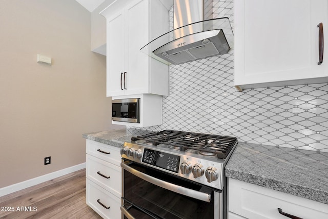 26647 N 43rd St N, Cave Creek, AZ 85331 - kitchen with stainless steel appliances, wall chimney exhaust hood, backsplash, and white cabinets