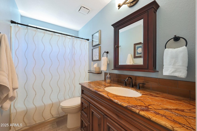 26647 N 43rd St N, Cave Creek, AZ 85331 - bathroom with vanity, a shower with shower curtain, tasteful backsplash, and wood finished floors