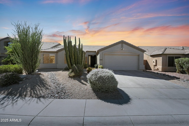 26647 N 43rd St N, Cave Creek, AZ 85331 - ranch-style house featuring an attached garage, concrete driveway, a tile roof, and stucco siding