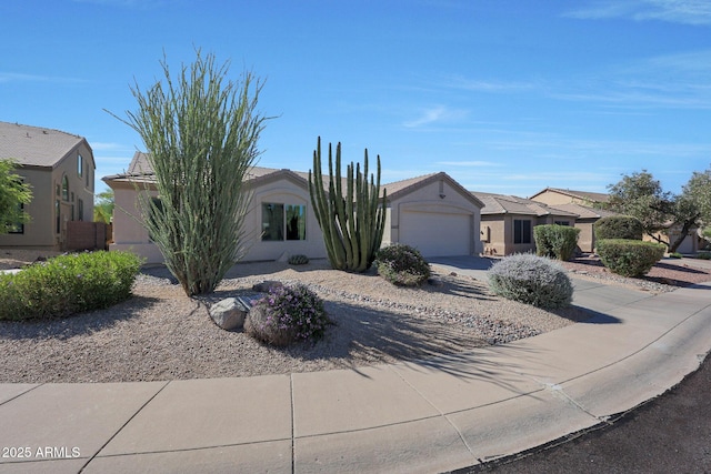 26647 N 43rd St N, Cave Creek, AZ 85331 - view of property hidden behind natural elements featuring an attached garage, driveway, and stucco siding