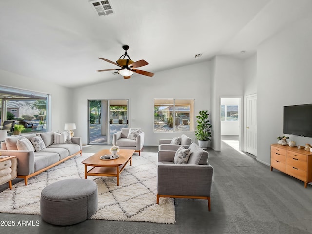 living room with carpet flooring, ceiling fan, and vaulted ceiling