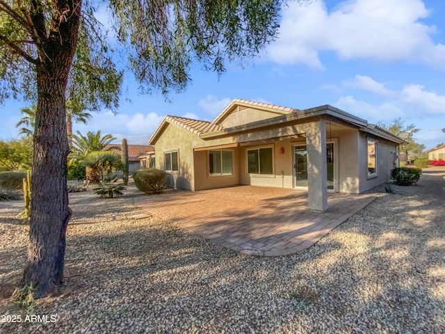 back of property with a patio area