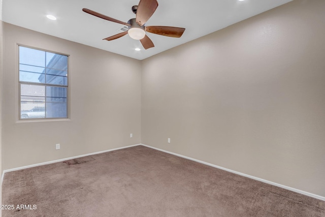 unfurnished room featuring carpet floors and ceiling fan