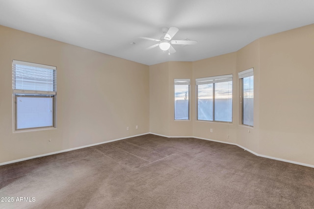 empty room with light colored carpet and ceiling fan