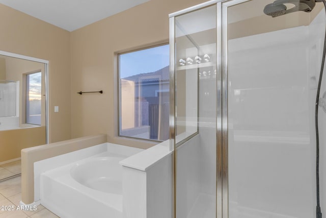 bathroom with plus walk in shower, tile patterned flooring, and a wealth of natural light