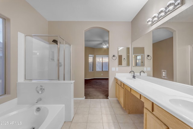 bathroom with tile patterned flooring, vanity, independent shower and bath, and ceiling fan