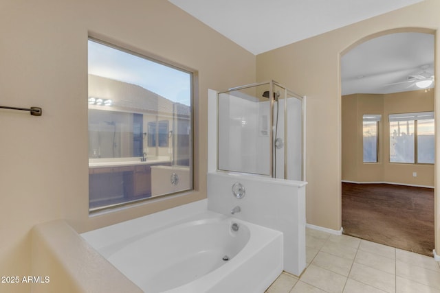 bathroom featuring tile patterned flooring, separate shower and tub, and ceiling fan